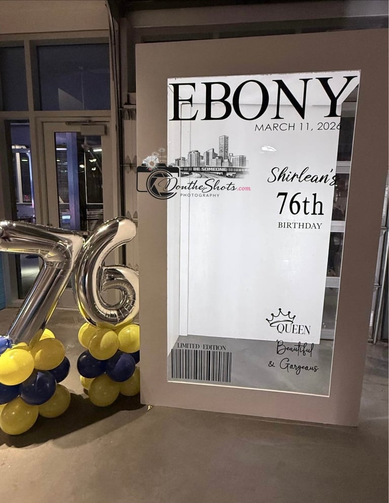 Ebony magazine cover display for 76th birthday celebration with gold and black balloons and number 16 balloon