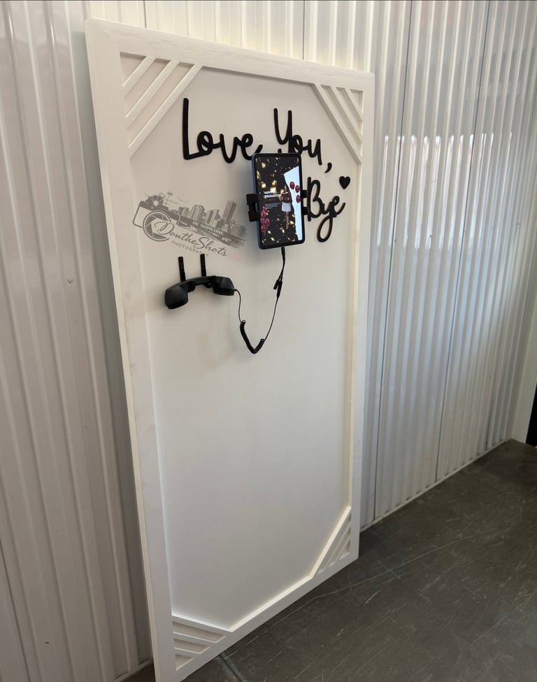 White door with love you babe handwritten text and decorative elements including a cassette tape and headphones drawing